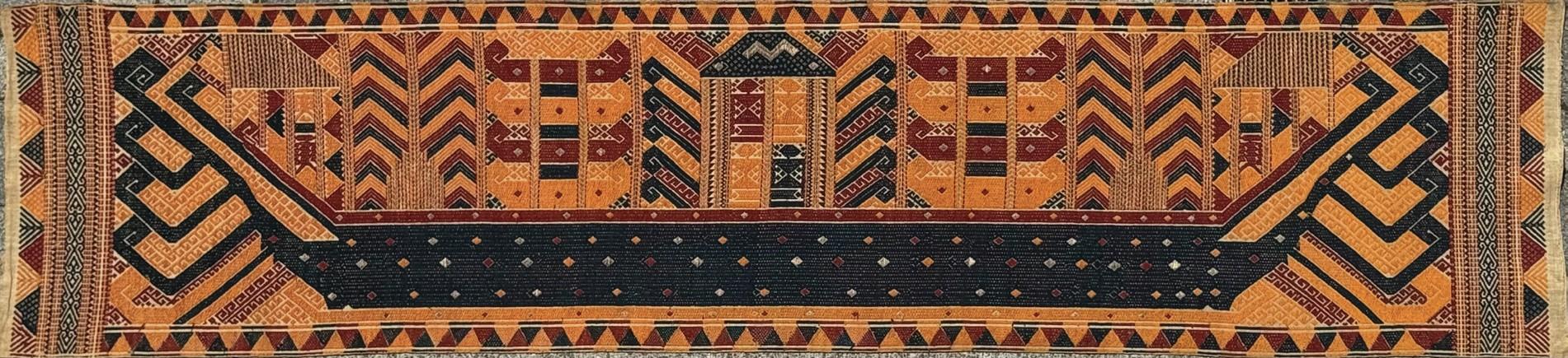 Sumatran ship banner sails in to London rug and textile fair