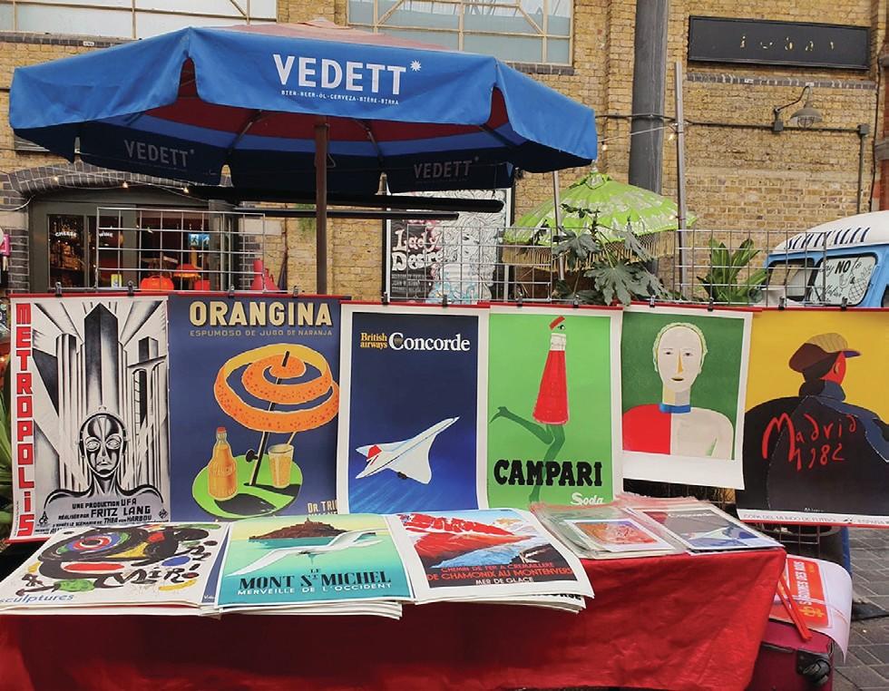 A market stall full of colourful poster art