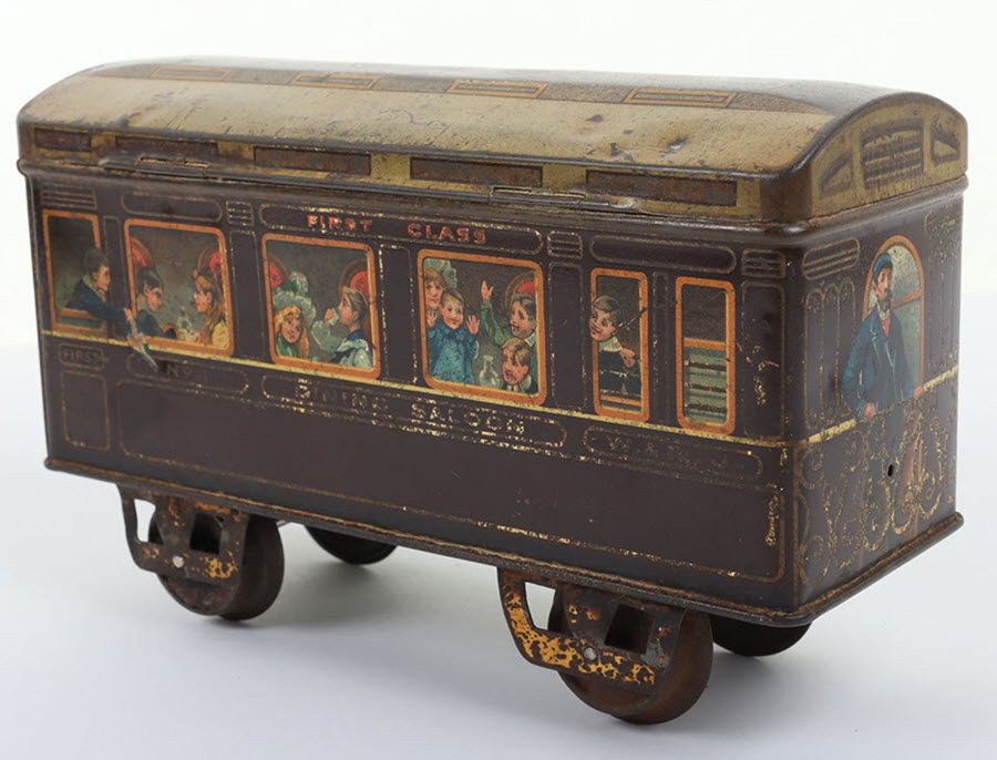 A biscuit tin in the shape of a railway passenger coach