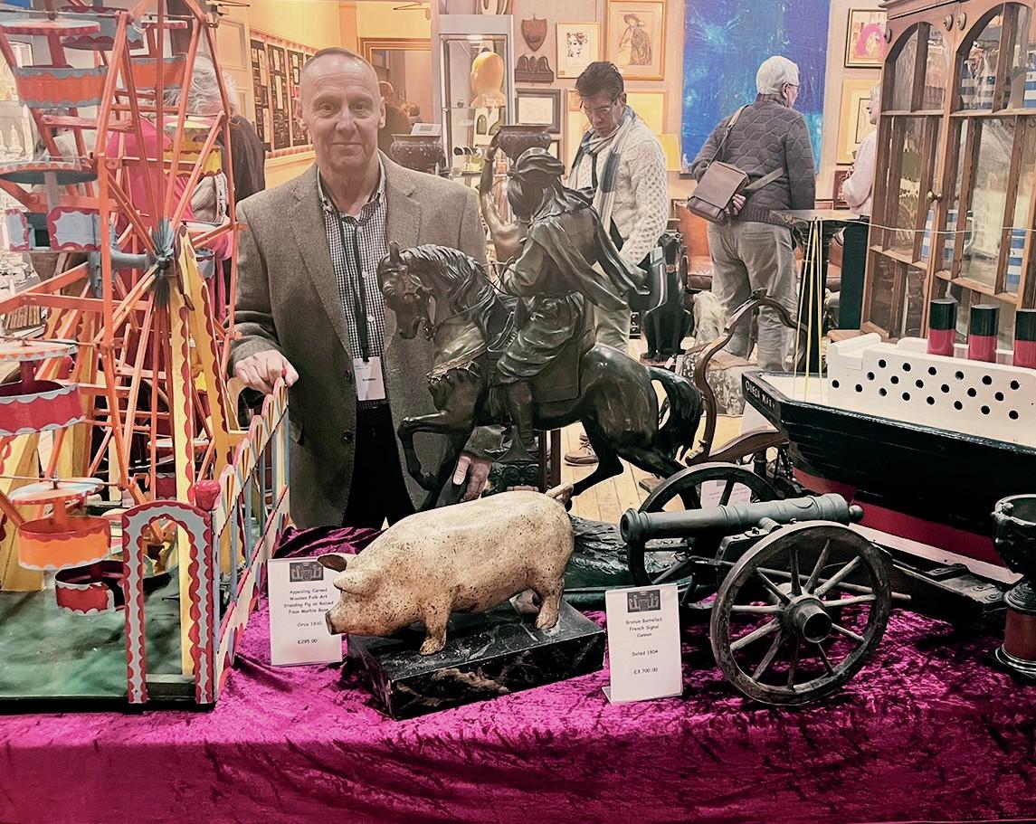 Dealer Lee Williams from Cougar Antiques at his stall at an antiques fair