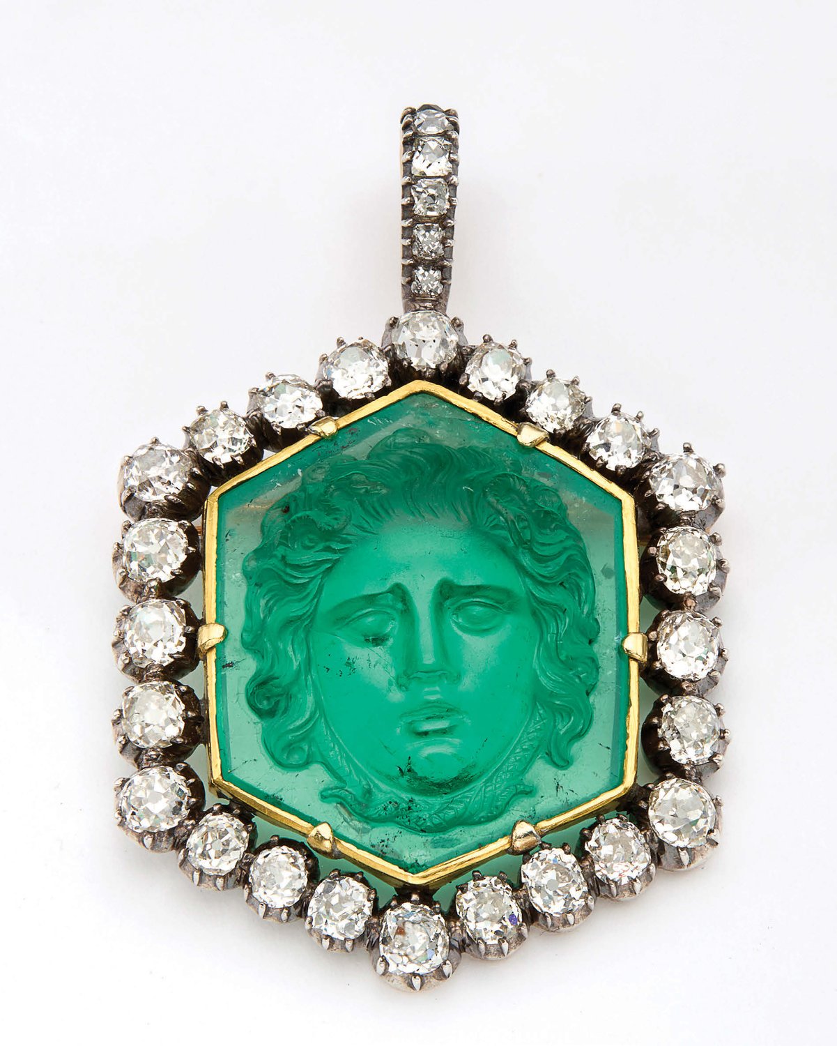 Georgian pendant centred by an emerald carved with the head of Medusa