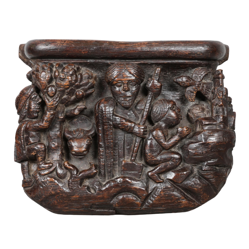 A carved English medieval oak misericord