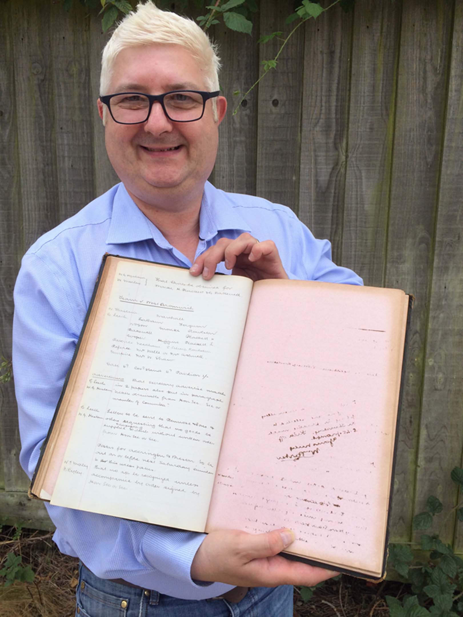 Alistair Lofley with 1888 DCFC minutes book CREDIT Hansons.jpg