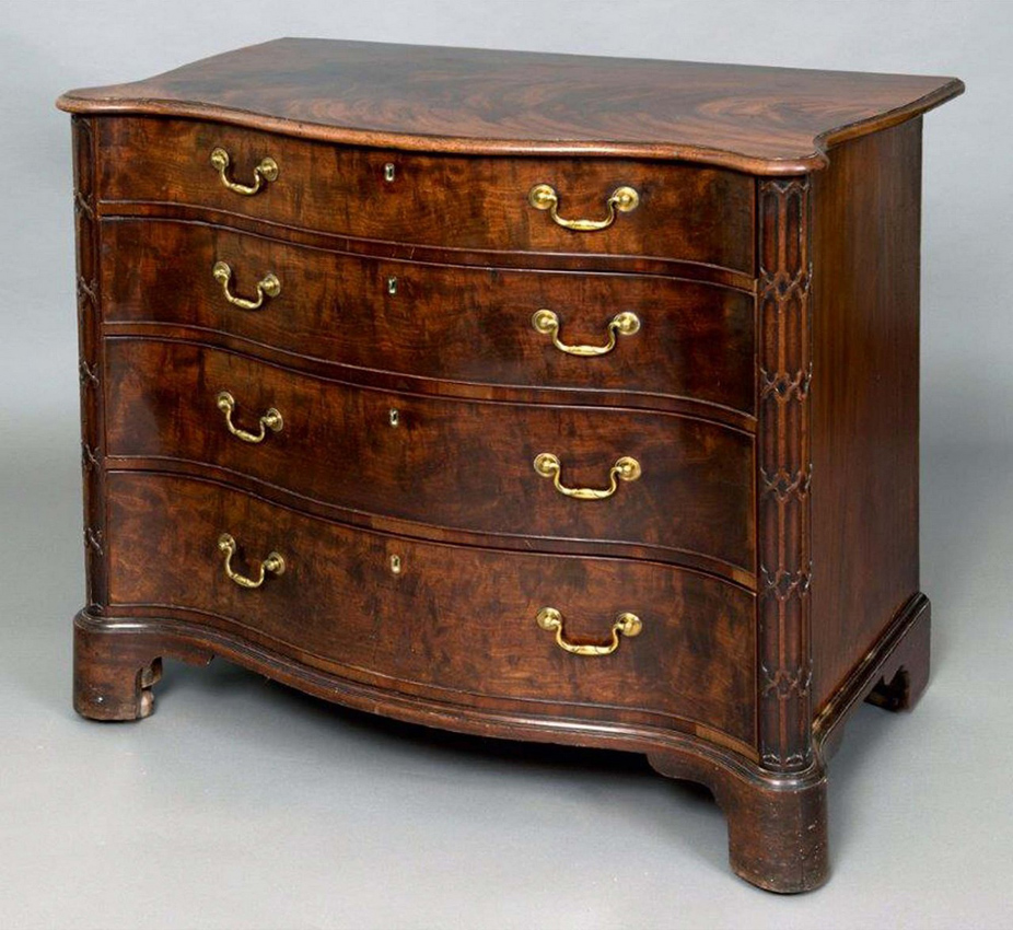 Antique mahogany serpentine commode