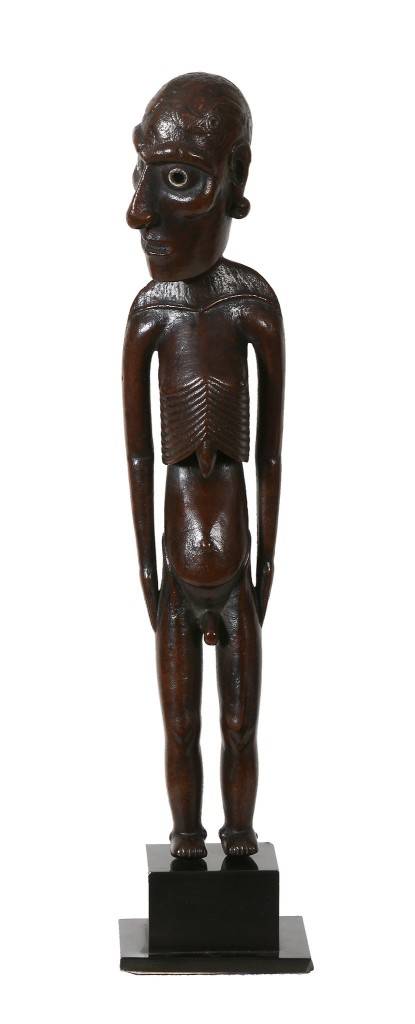 Moai kavakava figure at auction